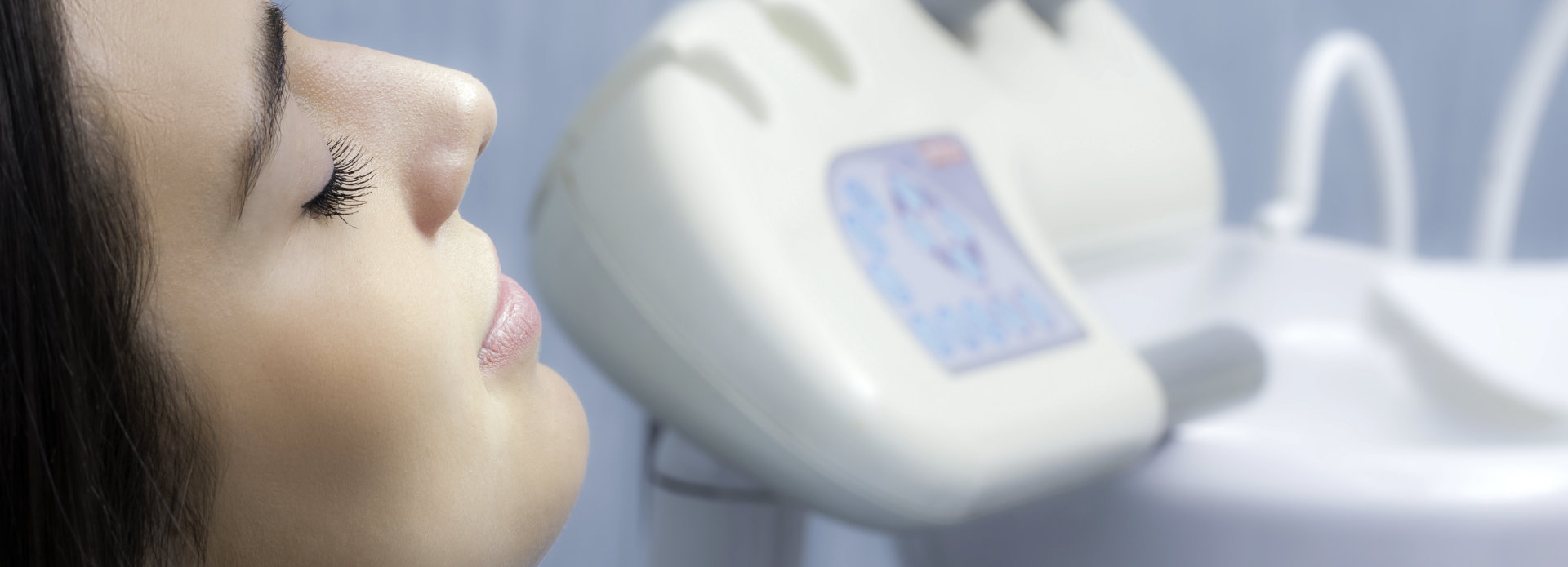 A woman in a dental chair under dental sedation Atlanta GA