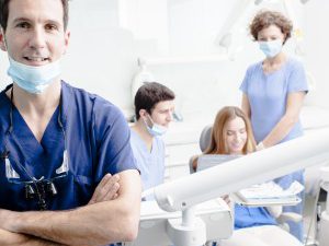 A group of dentists in a dental office.