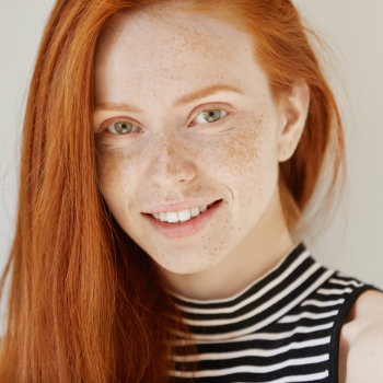 gentle redhead girl smiling